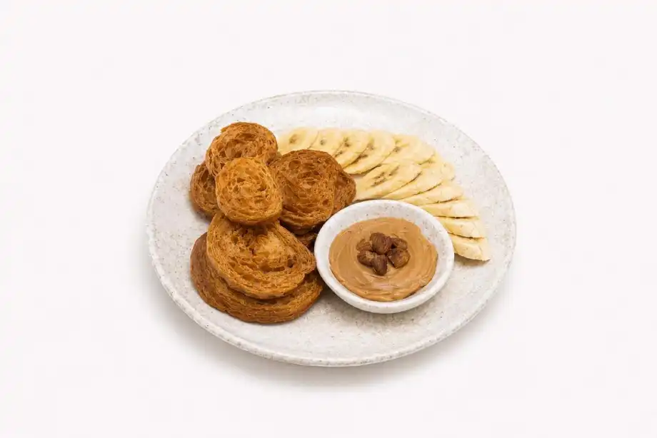Crispy croissant plate with peanut butter and banana